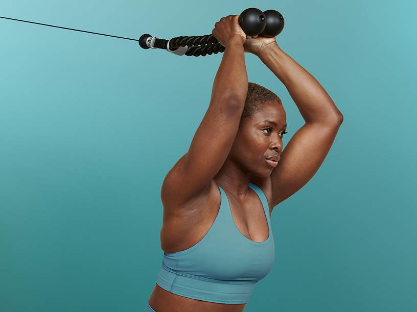 Tonal instructor pressing rope above her head
