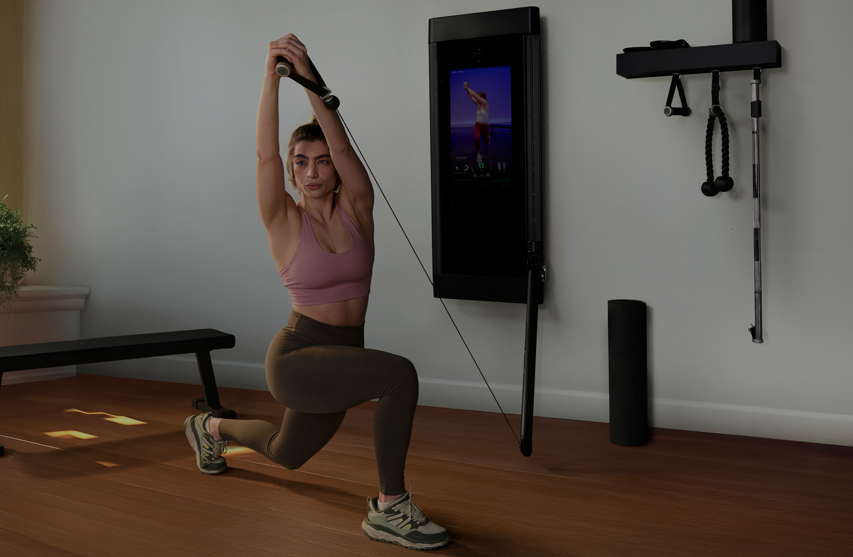 Woman athlete doing core work with Tonal