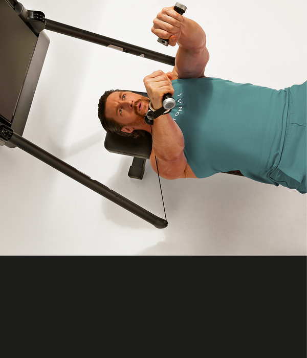 Man laying on bench doing bench press
