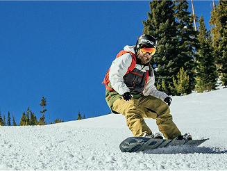 Man snowboarding down a mountain