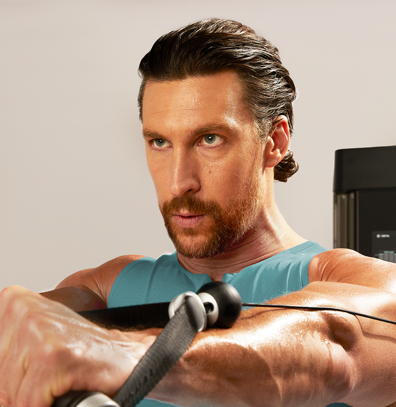Man looking past camera doing chest press