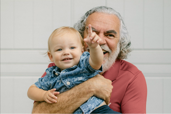 Grandparent holding grandchild