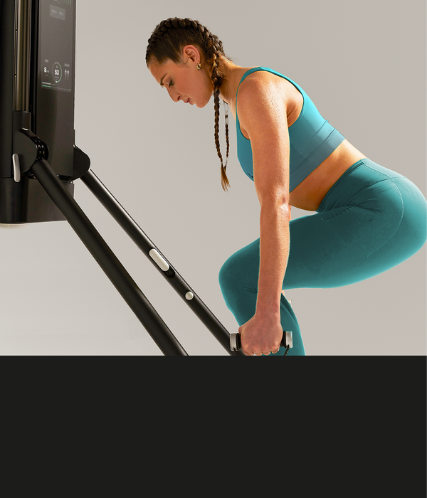 Woman bending down doing racked offset squat