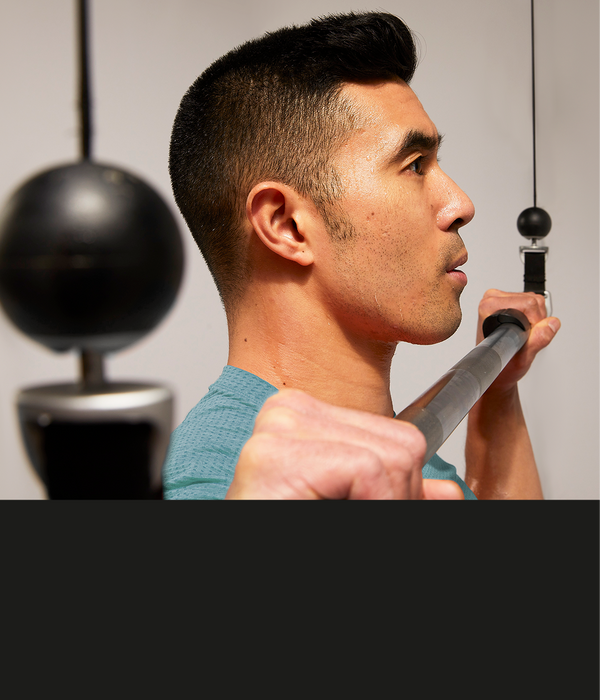 Man doing barbell pulldown